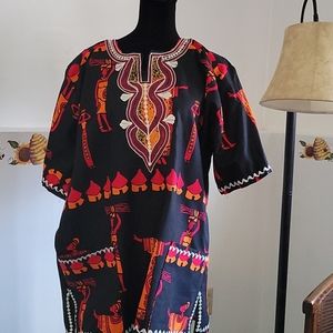 A  home crafted machine embroidered tunic.
